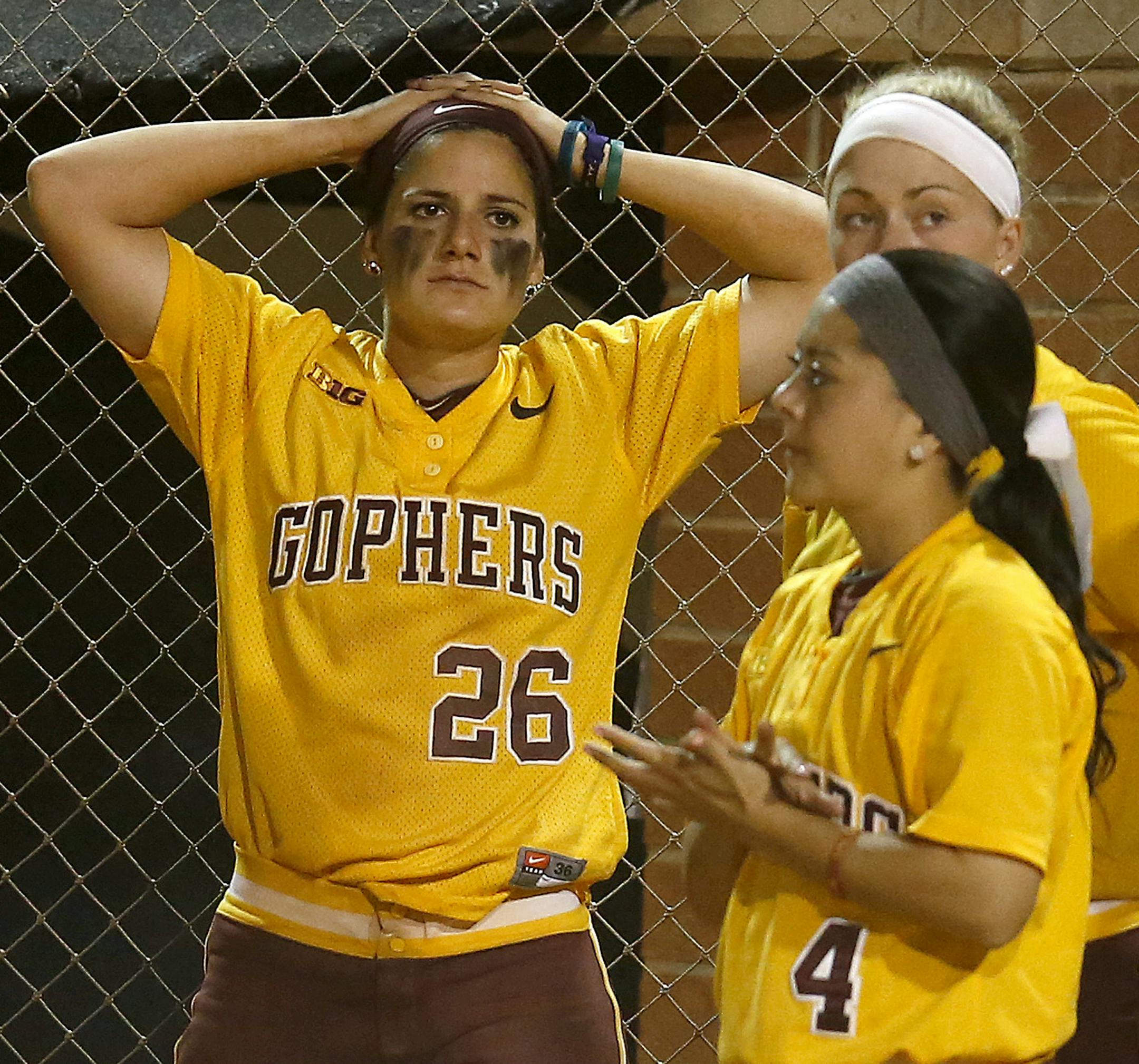 Gophers infielder Kaitlyn Richardson (26) and teammates reacted after their season finally ended.