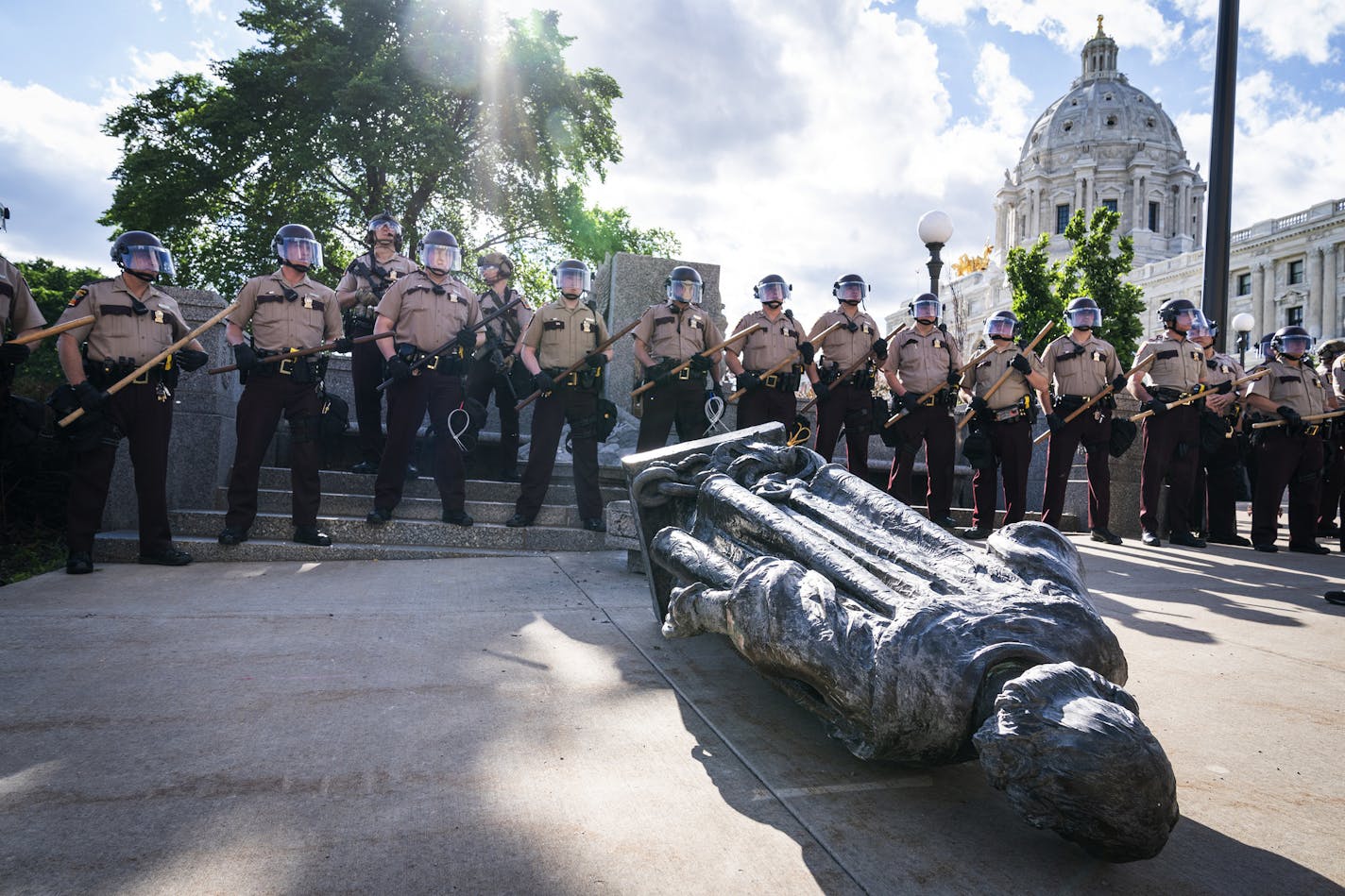 State Troopers surrounded the statue of Christopher Columbus after it was toppled in front of the Minnesota Capitol on June 10.