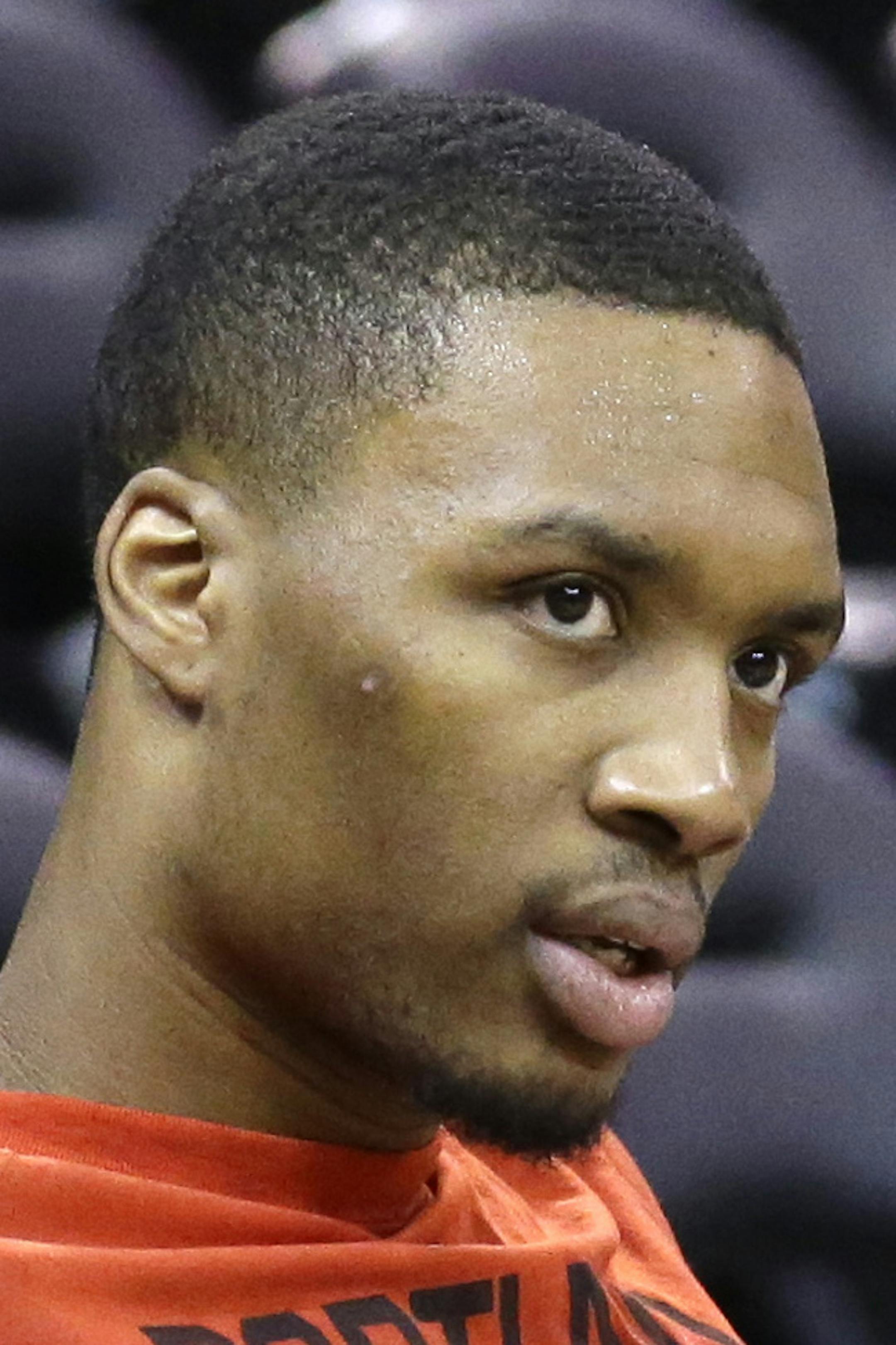 Portland Trail Blazers guard Damian Lillard looks on during practice before the start of their NBA preseason basketball game against the Utah Jazz Monday, Oct. 12, 2015, in Salt Lake City. (AP Photo/Rick Bowmer) ORG XMIT: MIN2015103022143393