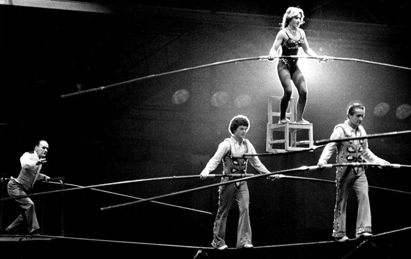 January 19, 1978 HIGH-LEVEL SUPERVISOR - Karl Wallenda. left, who will mark his 73rd birthday this weekend, supervised his grandchildren, Rietta, 17, and Mario, 21, and two students, Louis Murillo and Bubba Hettig (one not pictured), as they performed 40-feet above the ground in the old St.Paul Auditorium last night. Wallenda also walked the wire once in the act that was part of the Minnesota Sportsman's Show, which runs through Sunday. The stage performances are 9 p.m. today and tomorrow, 3:30