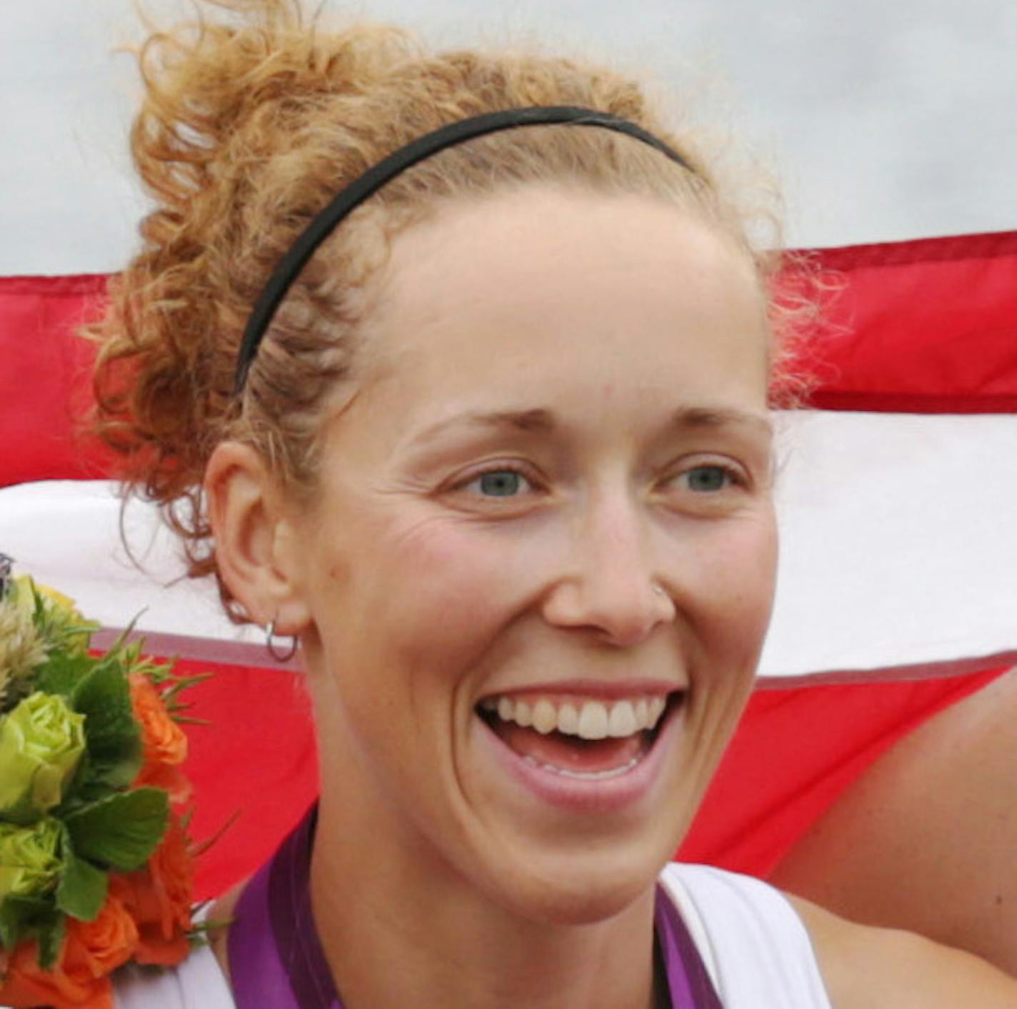 U.S. rowers Adrienne Martelli, Megan Kalmoe, Kara Kohler, and Natalie Dell display the bronze medals they won in the women's rowing quadruple sculls in Eton Dorney, near Windsor, England, at the 2012 Summer Olympics, Wednesday, Aug. 1, 2012. (AP Photo/Armando Franca)