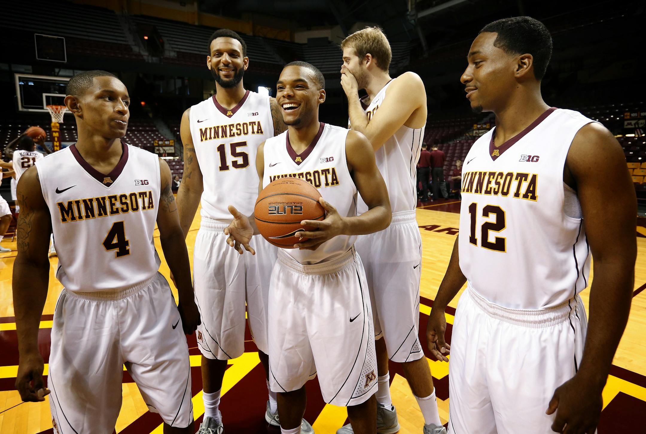 University of Minnesota seniors DeAndre Mathieu (4), Mo Walker (15), Andre Hollins (1), Elliott Eliason (55) and Kendal Shell (12) enjoyed a lighthearted moment before posing for a photo. ] CARLOS GONZALEZ cgonzalez@startribune.com - October 21, 2014 , Minneapolis, MN, Williams Arena, University of Minnesota Men‚Äôs Basketball, Gophers, Gophers basketball media