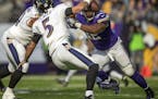 Vikings Tom Johnson closes in on Ravens quarterback Joe Flacco for the sack in the 2nd quarter. ] Minnesota Vikings -vs- Baltimore Ravens US Bank Stad