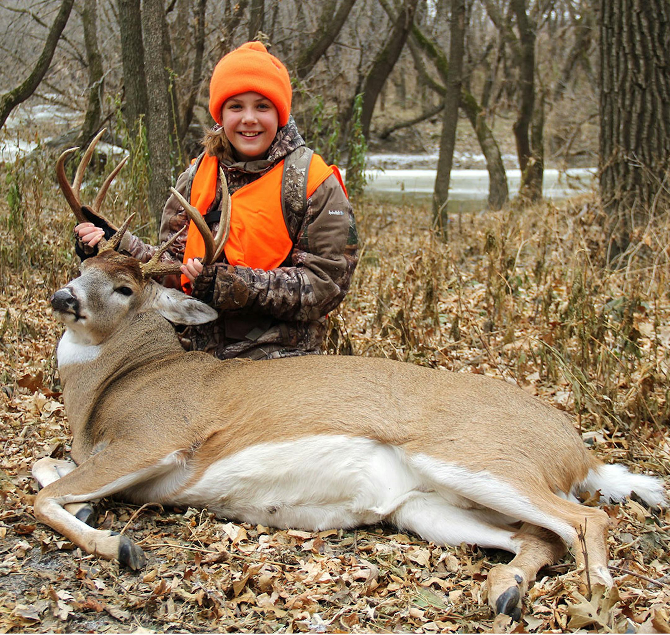 Eleanor Porisch, 11, of Edina, was with her father on family land near Climax for opening day of the firearms season when this grand eight-point buck walked in below their elevated deer stand. Sand Hill River, a tributary to nearby Red River of the North, is in the background.