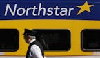 Conductor J.R. Long waked by the Northstar Commuter Rail at Target Field on Tuesday. ] CARLOS GONZALEZ &#xef; cgonzalez@startribune.com , July 19, 201