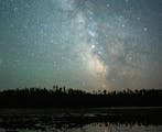 Planets Mars (left) and Saturn (center) shine brightly against the backdrop of the Milky Way above Fire Lake in the Boundary Waters Canoe Area. ] MARK