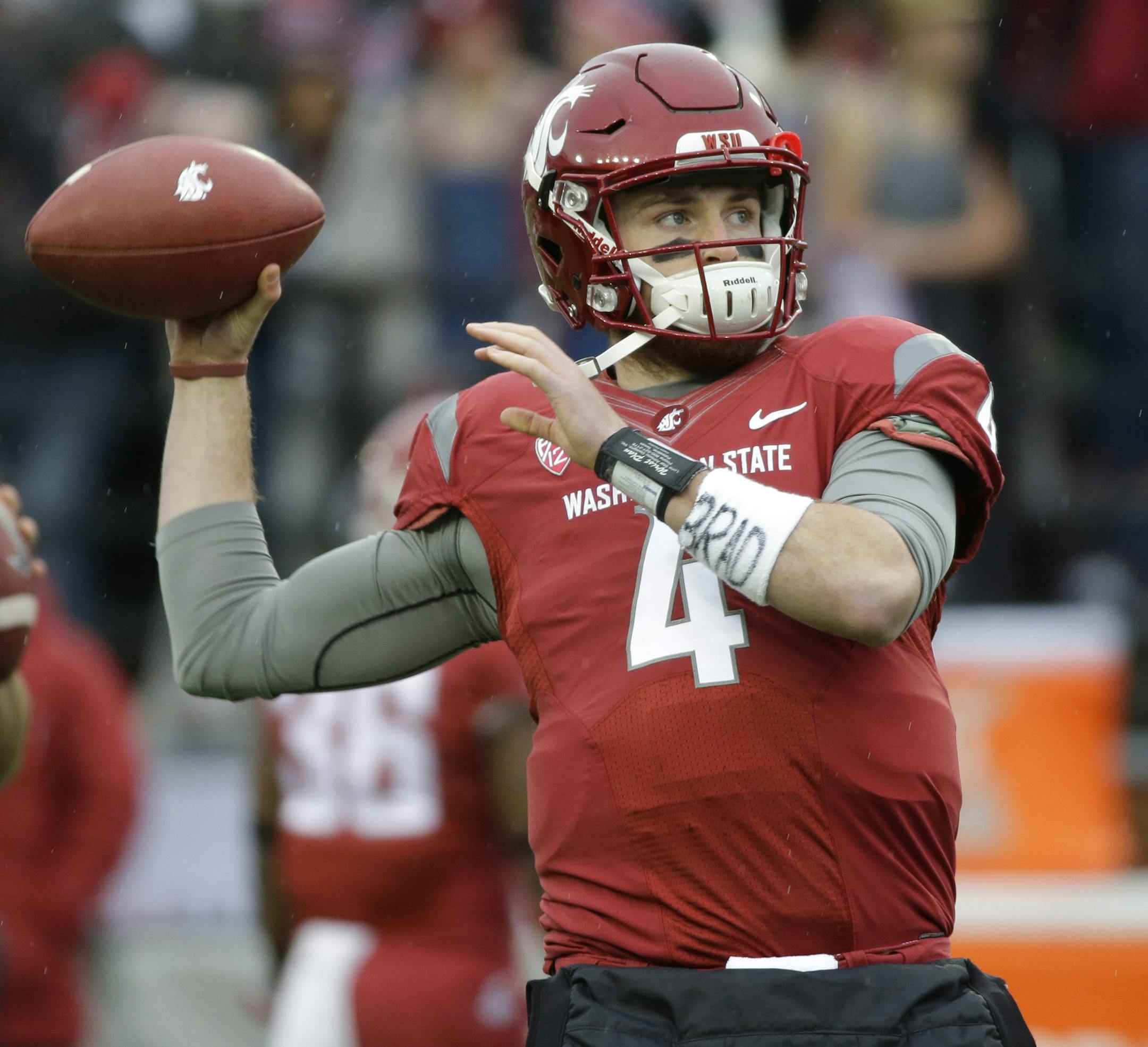 Washington State quarterback Luke Falk (4) warms up before an NCAA college football game against Washington, Friday, Nov. 25, 2016, in Pullman, Wash. (AP Photo/Ted S. Warren)