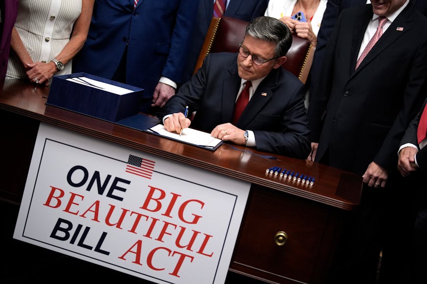 House Speaker Mike Johnson, with Republican leaders, signs the "One Big Beautiful Bill Act" on Capitol Hill in Washington, D.C., on July 3, 2025.