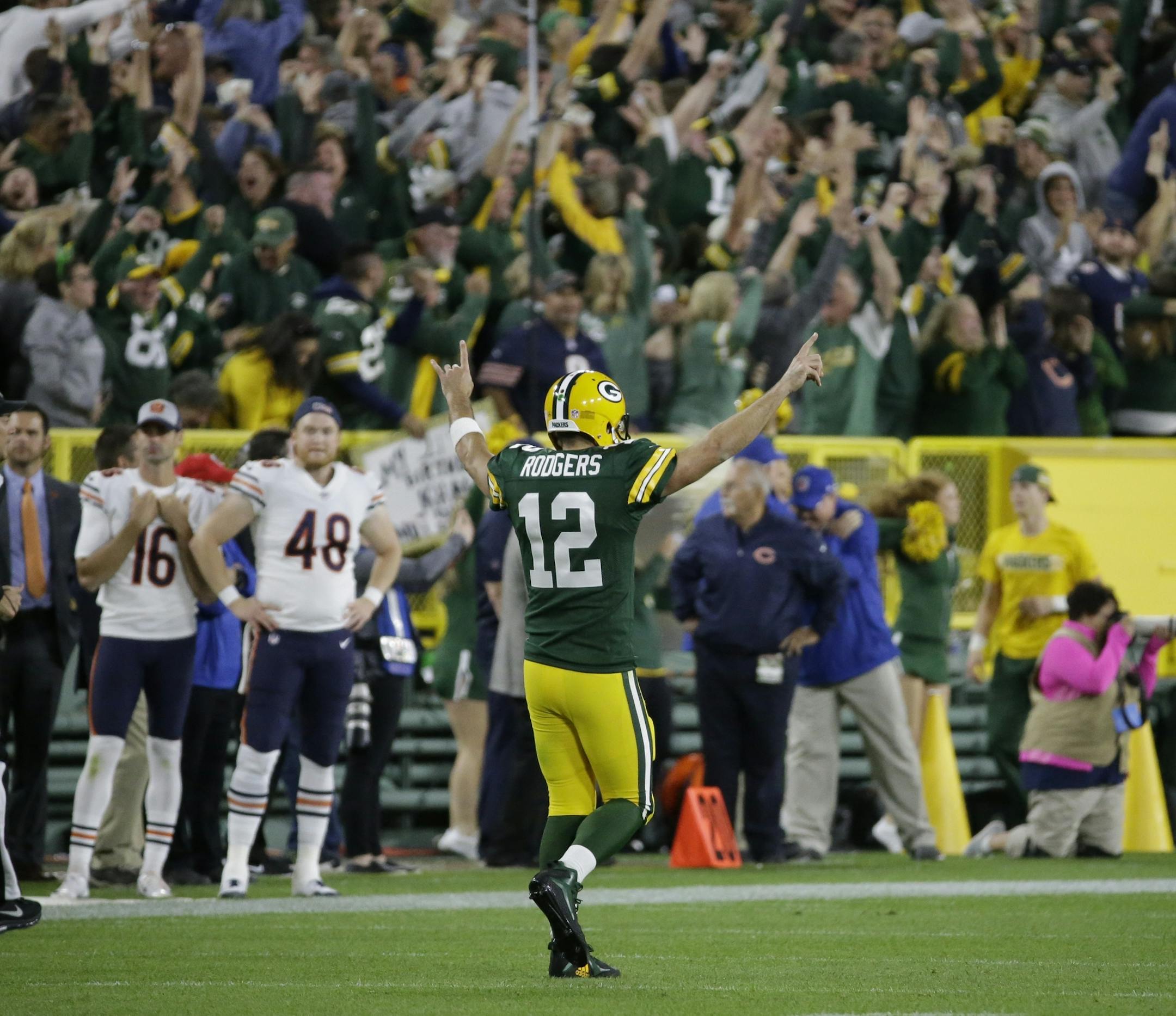 Green Bay Packers' Aaron Rodgers reacts after throwing a 75-yard touchdown pass to Randall Cobb during the second half of an NFL football game against the Chicago Bears Sunday, Sept. 9, 2018, in Green Bay, Wis. (AP Photo/Mike Roemer)
