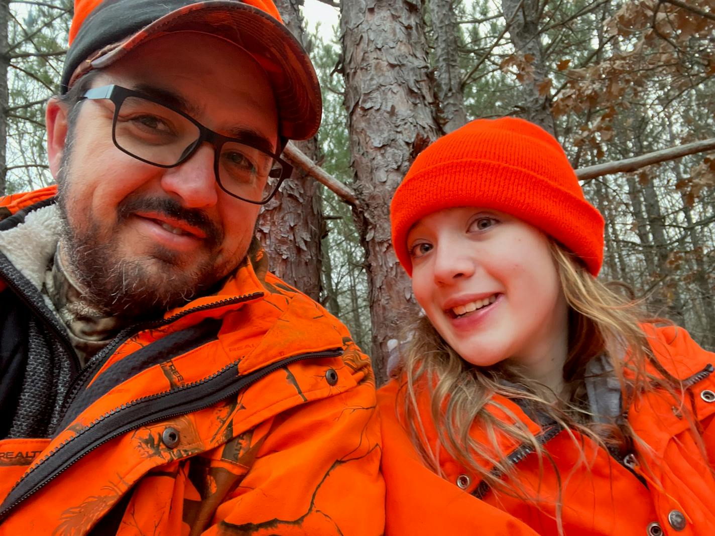 Andrew Weber of Woodbury in a tree stand Saturday morning with daughter Julia, 13. They were in step with a 50-year tradition of deer hunting with close family friends in the backwoods of Crow Wing County.