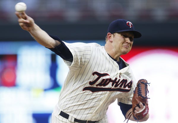 Minnesota Twins pitcher Tyler Duffey throws against the Seattle Mariners during the first inning of a baseball game Saturday, Sept. 24, 2016, in Minne