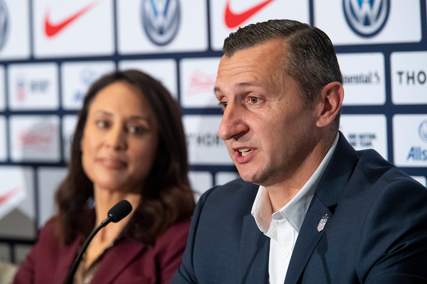 Kate Markgraf, general manager of the U.S. women's national soccer team, listens as newly hired head coach Vlatko Andonovski speaks at a news conference Oct. 28 in New York.