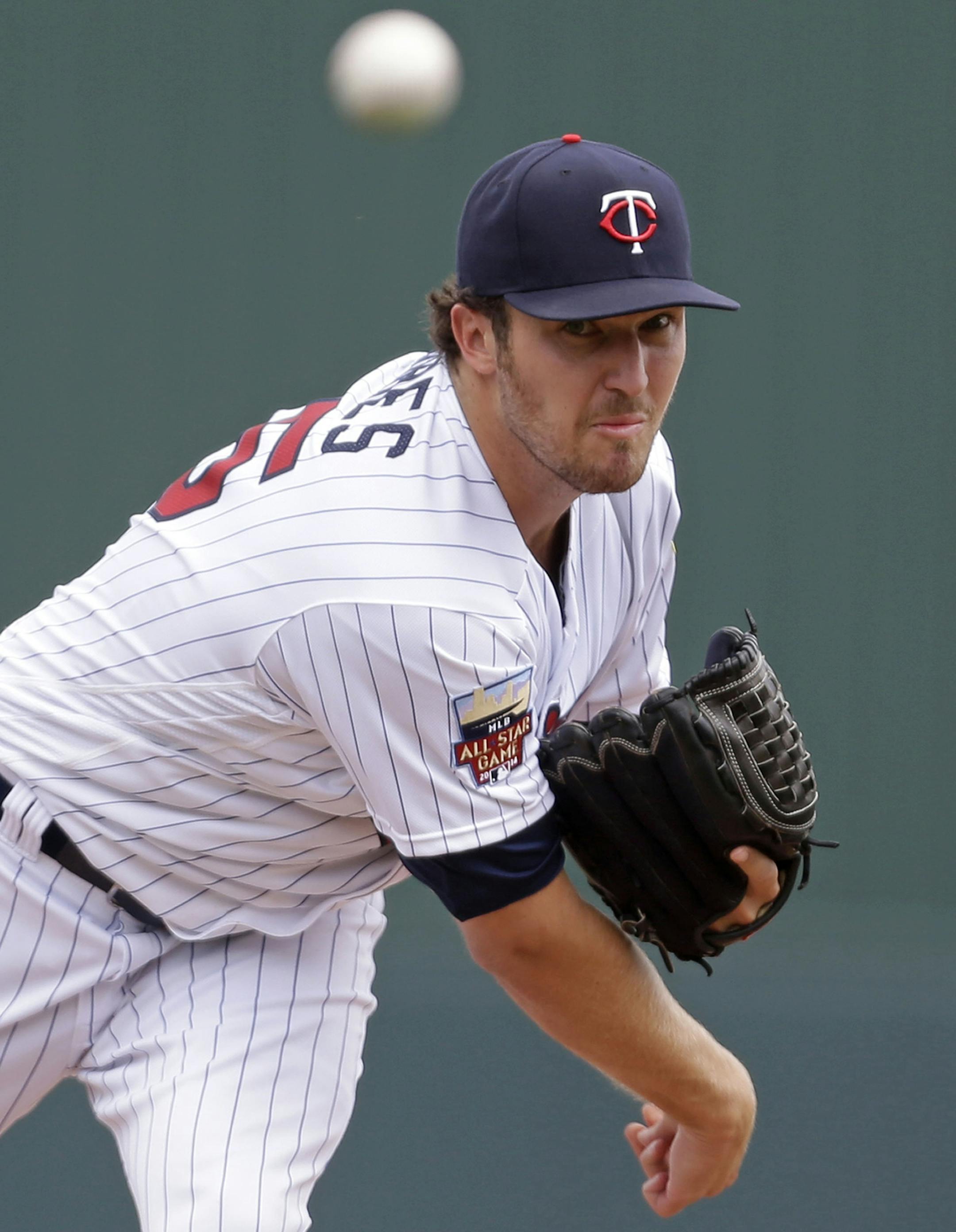 Minnesota Twins starting pitcher Phil Hughes (45) pitches in the first inning of an exhibition baseball game against the Boston Red Sox in Fort Myers, Fla., Friday, March 28, 2014. (AP Photo/Gerald Herbert)