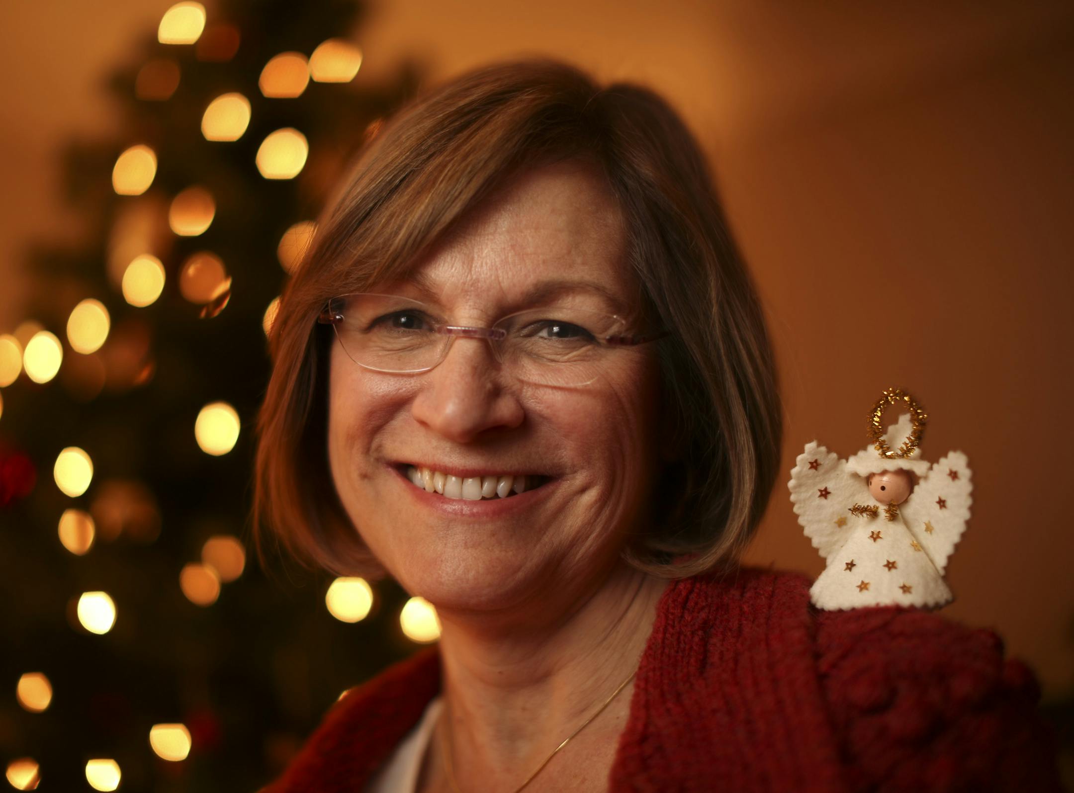 Pat Kuehn of Plymouth with an angel ornament made by her mother in the mid-60's. Pat and her sisters used to sell them door to door for "a needy family," not realizing that they were the needy family and her mother needed the money to buy them Christmas gifts. She was photographed Monday night, December 16, 2013. ] JEFF WHEELER ‚Ä¢ jeff.wheeler@startribune.com