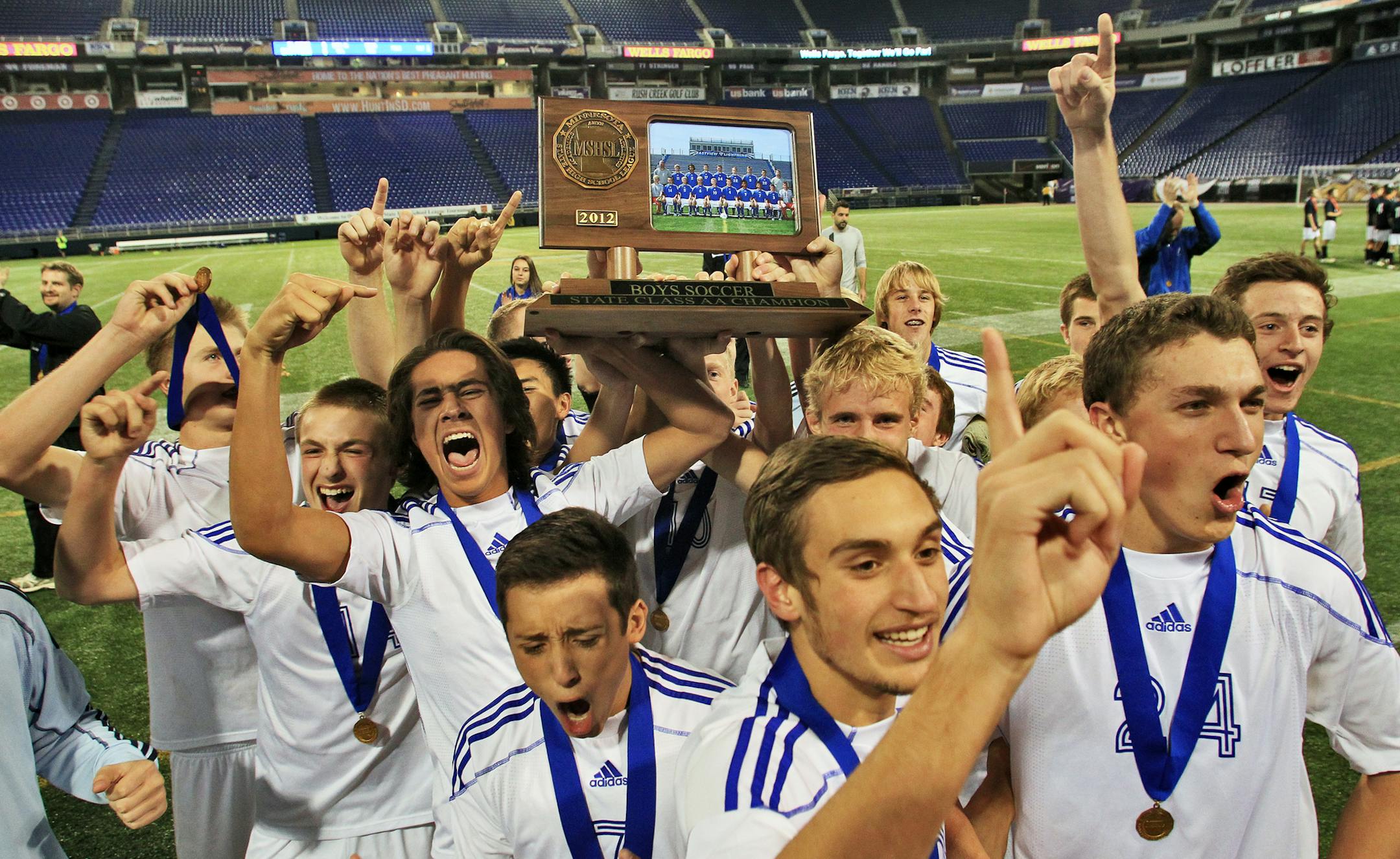 Boys 2A Soccer Championship - Blaine vs. Eastview. Eastview won 3-2. Eastview players celebrated with the championship trophy. (MARLIN LEVISON/STARTRIBUNE(mlevison@startribune.com (cq all names program ) ORG XMIT: MIN1211012026235453