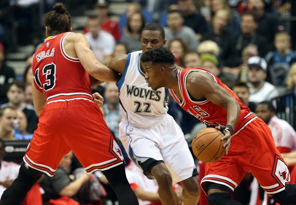 Jimmy Butler drives to the basket against the Wolves.
