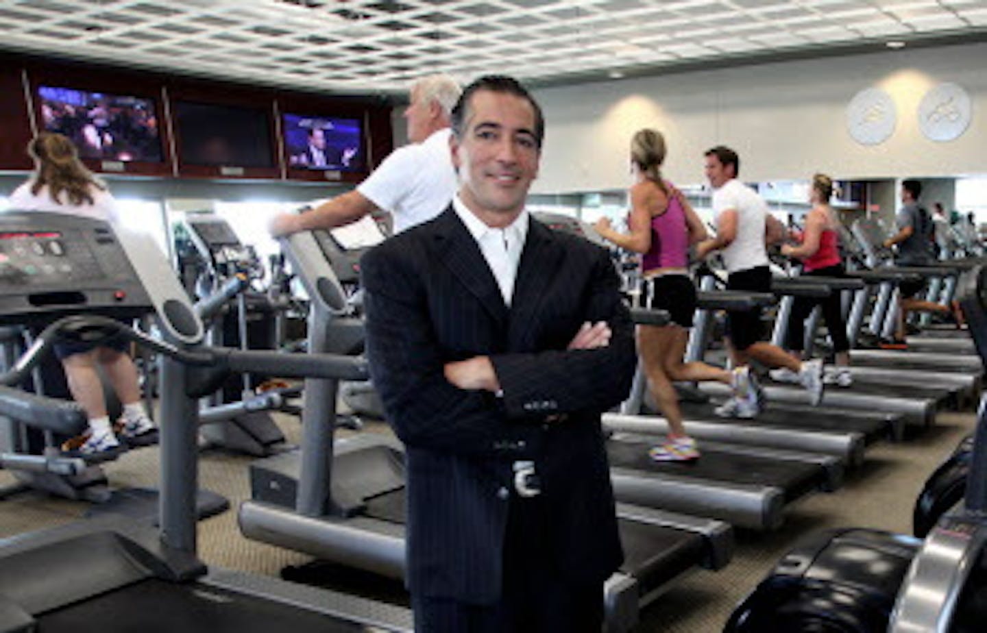 DAVID JOLES * djoles@startribune.com Chanhassen, MN - Sept. 17, 2009-] In a tight economy Life Time Fitness has grown and after briefly faltering, stocks of the company are again climbing. Aside from the top of the line fitness facilities, Life Time has opulence, with banks of TVs in workout rooms, featuring their own LTF TV channel with original programming. Life Time also features a cafe and spa. A key figure is the success of the company is Life Time CEO Bahram Akradi, seen in one of the work