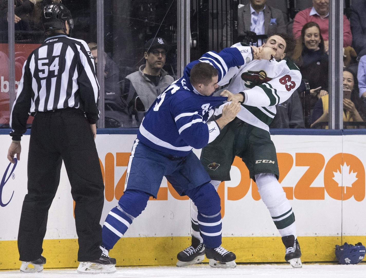 Toronto Maple Leafs defenseman Roman Polak, left, fights with Minnesota Wild right wing Kurtis Gabriel during the second period of an NHL hockey game in Toronto on Wednesday Dec. 7, 2016. (Chris Young/The Canadian Press via AP)