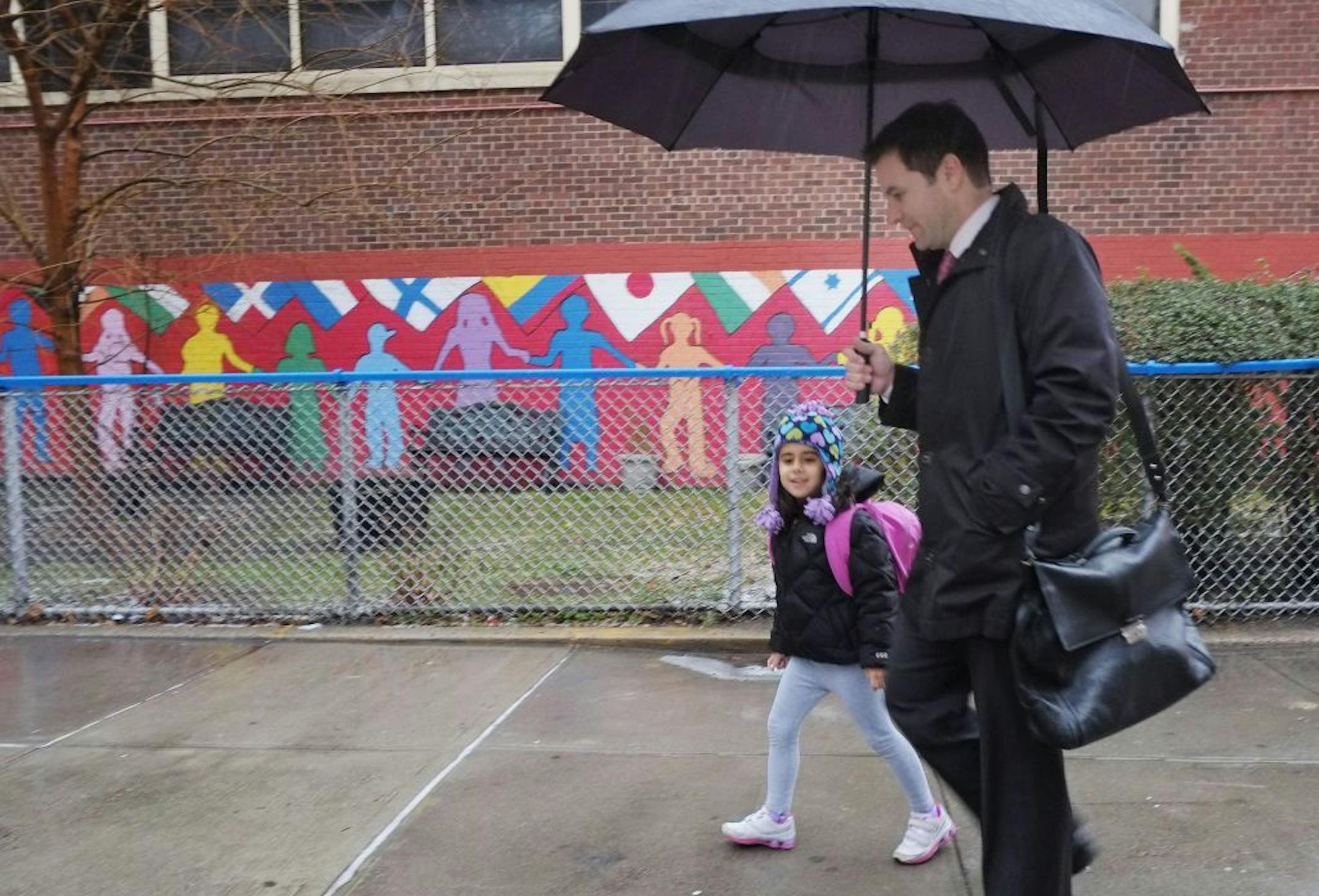 Matthews Mosca takes his daughter, Ella, to her kindergarten class at Public School 33, Wednesday, Jan. 16, 2013 in New York. Mosca said his 5-year-old usually takes the bus from their home on Manhattan's East Side, but took a taxi today. More than 8,000 New York City school bus drivers and aides went on strike over job protection Wednesday morning, leaving some 152,000 students trying to find other ways to get to school.