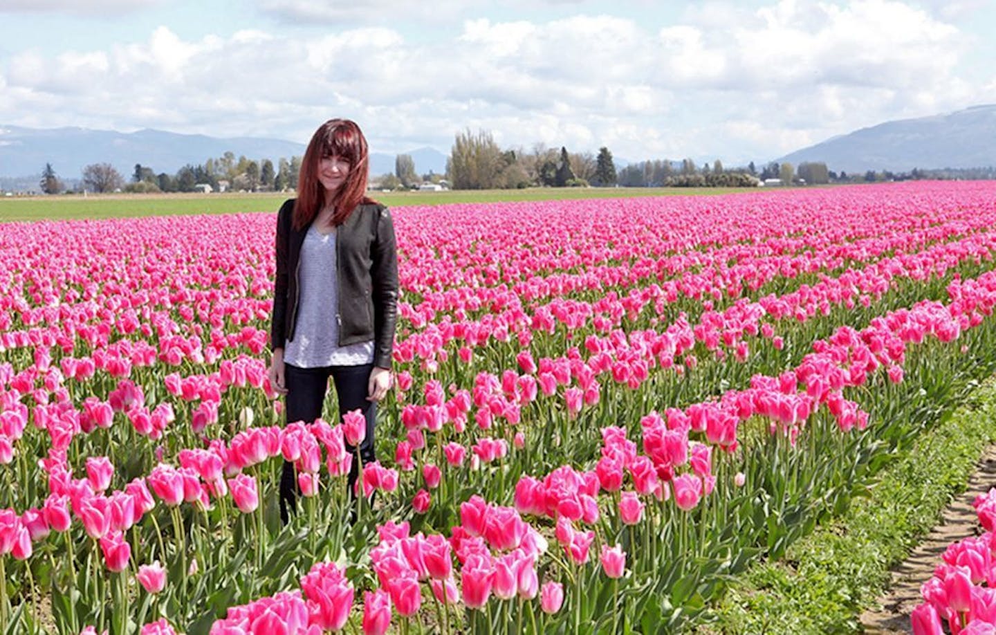 Cutline: Casey Sperzel moved from Minnesota to Seattle last year because she liked the culture, weather and prospects for career growth. She is shown here at the Skagit Valley Tulip Festival in Mount Vernon, Wash.