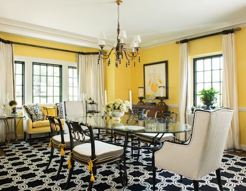 Kelley Proxmire had carpet cut specifically to fit the space in her own dining room, making it look larger. Proxmire uses lots of green plants in her work, and is adamant that they look healthy. Illustrates DESIGN-STAGE (category l), by Jura Koncius, (c) 2014, The Washington Post. Moved Thursday, August 28, 2014. (MUST CREDIT: Kevin Allen.)