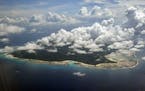 FILE &#x2013; In this Nov. 14, 2005 file photo, clouds hang over the North Sentinel Island, in India's southeastern Andaman and Nicobar Islands. An Am