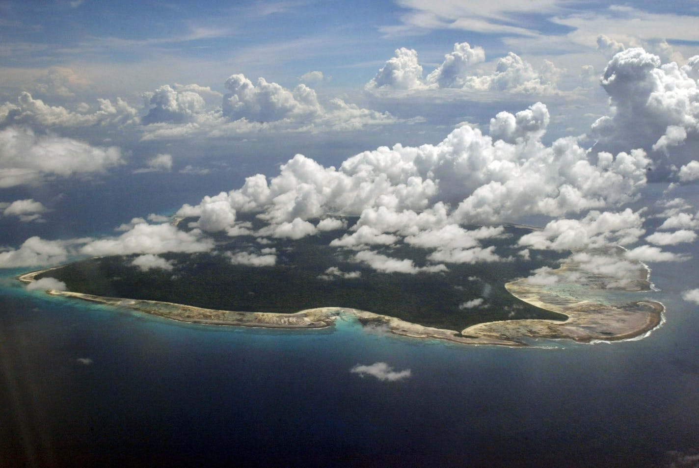 FILE &#x2013; In this Nov. 14, 2005 file photo, clouds hang over the North Sentinel Island, in India's southeastern Andaman and Nicobar Islands. An American is believed to have been killed by an isolated Indian island tribe known to fire at outsiders with bows and arrows, Indian police said Wednesday, Nov. 21, 2018.
Police officer Vijay Singh said seven fishermen have been arrested for facilitating the American's visit to North Sentinel Island, where the killing apparently occurred. Visits to th