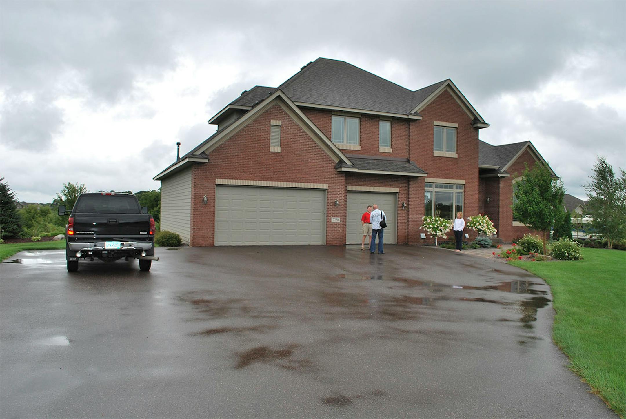 BEFORE: The home's former driveway was long and straight.