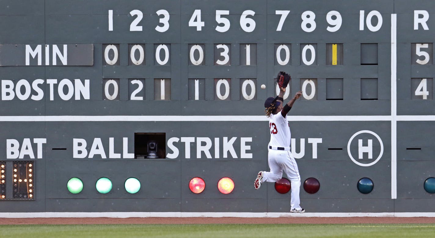 Boston Red Sox left fielder Hanley Ramirez can't make a play on an RBI double by Minnesota Twins Eduardo Escobar in the ninth inning during a baseball game, Thursday, June 4, 2015, at Fenway Park in Boston. (AP Photo/Charles Krupa)