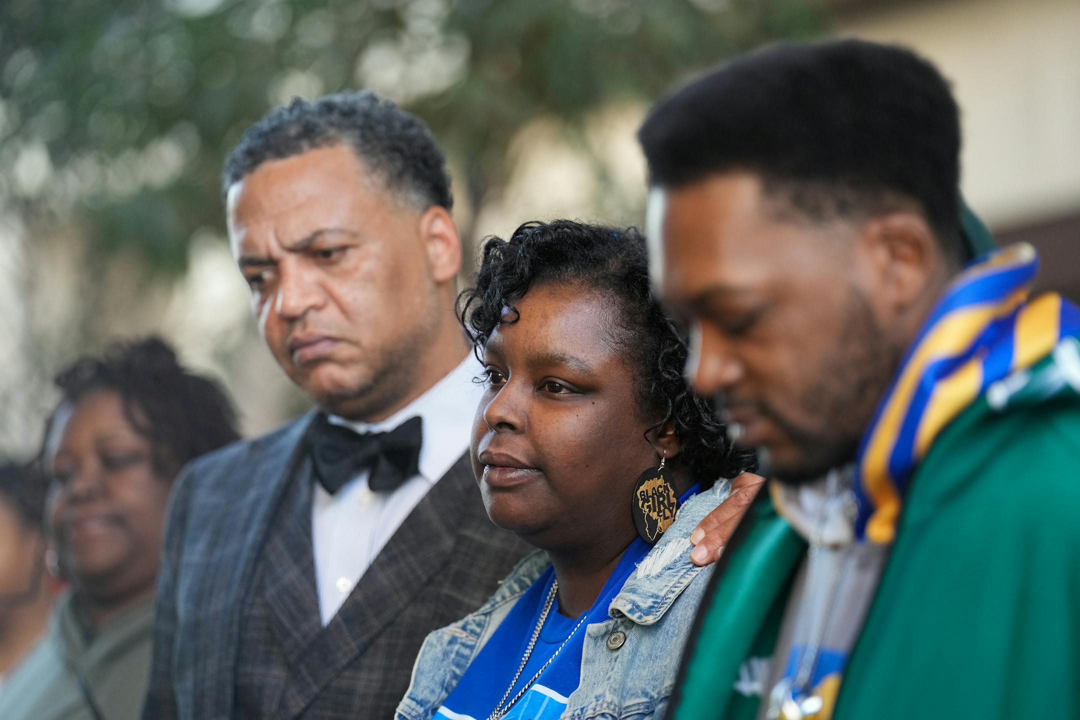 Family attorney William Walker, left, stands alongside Deshaun Hill, Jr.'s parents, Tuesday Sheppard and Deshaun Hill, Sr. as they address the media.