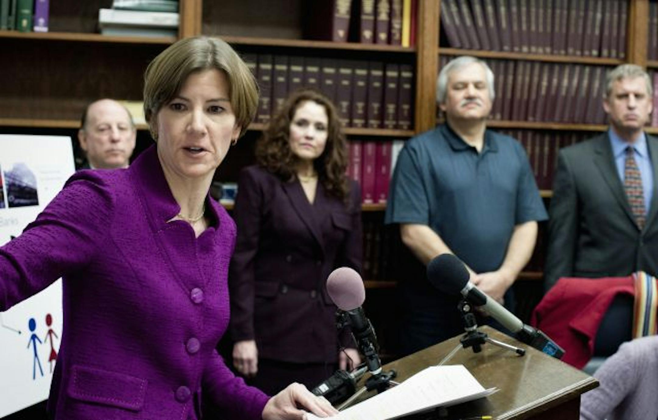 In March, Minnesota Attorney General Lori Swanson announced a legal filing against debt buyer Midland Funding for filing false and deceptive robo-signed affidavits. On the right are three victims of the debt buyer, Barbara Thies of Eagan, Daniel Fischer of Brooklyn Park, Michael Helmer of Shorewood.