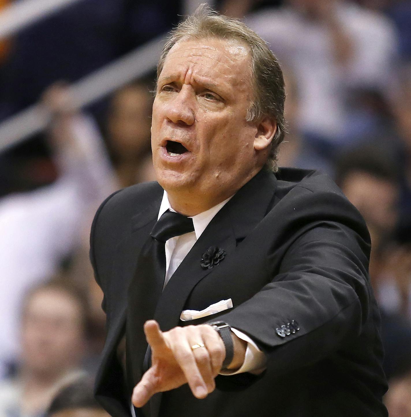 Minnesota Timberwolves coach Flip Saunders calls out a foul against the Phoenix Suns during the second quarter of an NBA basketball game, Wednesday, March 11, 2015, in Phoenix. (AP Photo/Rick Scuteri) ORG XMIT: MIN2015031323202477 ORG XMIT: MIN1503132321403843