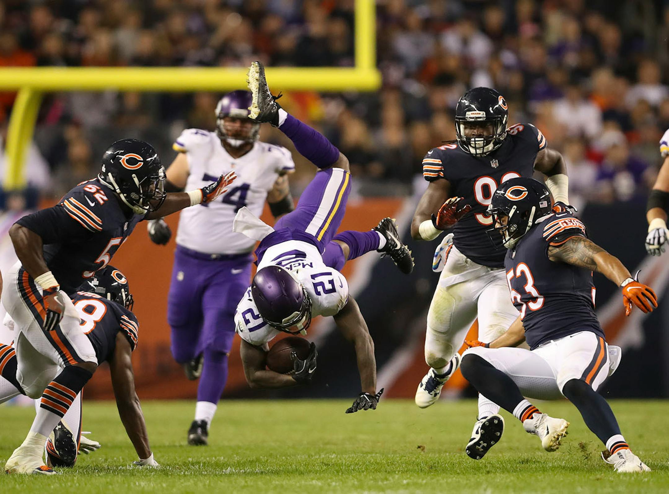 Minnesota Vikings running back Jerick McKinnon (21) was upended by Chicago Bears strong safety Adrian Amos (38) after gaining 11 yards near the end of the second quarter.