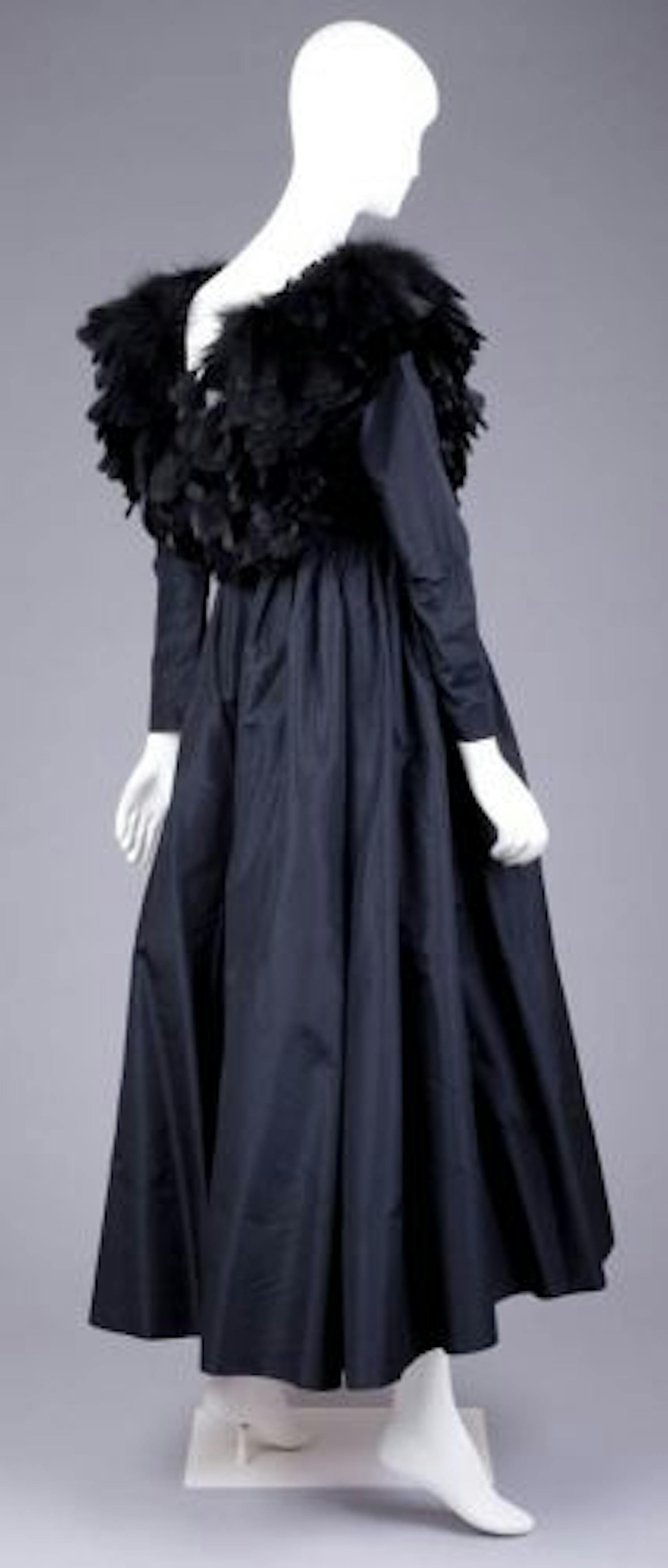 Oscar de la Renta dress features black feathers on the bodice.