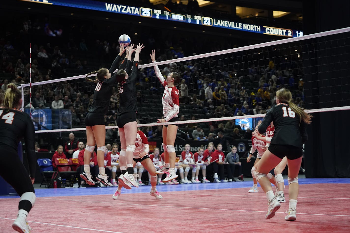 MarshallÕs Leah Jones (10) and Briele Riess (6) go to the net to block a shot by Benilde-St. MargaretÕs Sailor Fridley (3) during 3A volleyball finals Saturday, Nov. 12, 2022 at Xcel Energy Center in St. Paul, Minn. ]