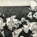 Bob McNamara, described as "touchdown ace" by the Minneapolis Tribune in this photo from Nov. 13, 1954, was carried off by the field by coach Murray W