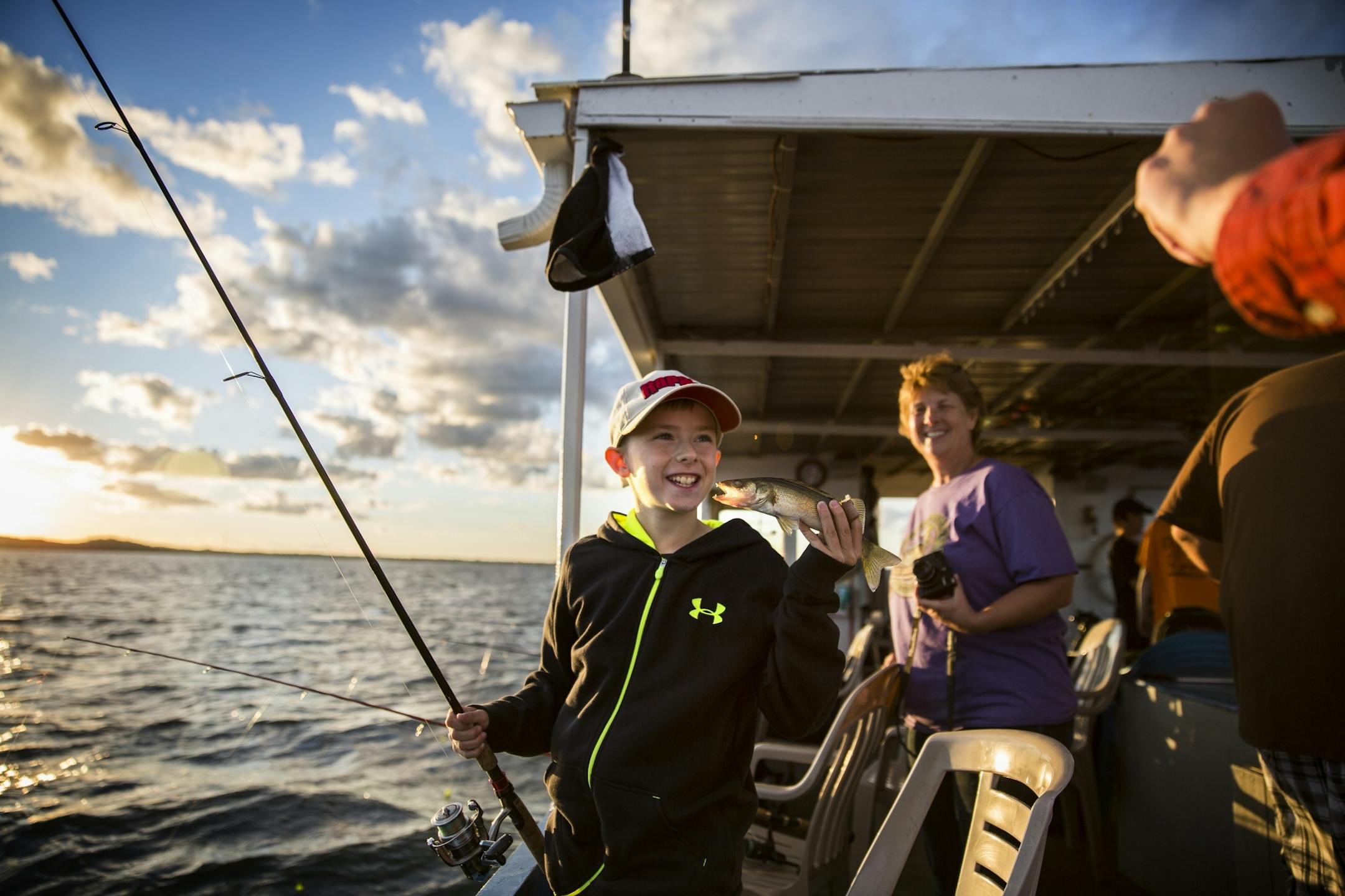 Wyatt Peterson, 10, of Excelsior poses with a walleye he caught during a fishing expedition with Twin Pines Resort on Mille Lacs Lake Monday, August 3, 2015.