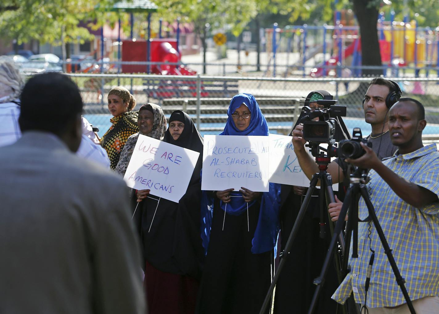 Somali American women, some holding signs, listened to speakers during the rally Friday, Sept. 27, 2013, outside the Brian Coyle Community Center in Minneapolis, MN, in the largely Somali American neighborhood, to condemn Al-Shabab's attack on Westgate shopping mall in Nairobi, Kenya recently.](DAVID JOLES/STARTRIBUNE) djoles@startribune.com A rally was held Friday, Sept. 27, 2013, outside the Brian Coyle Community Center in Minneapolis, MN, in the largely Somali American neighborhood, to condem