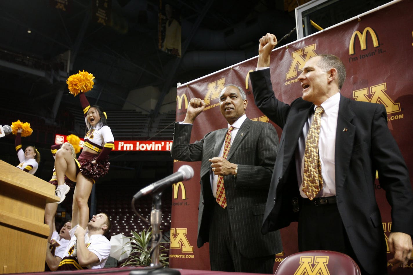 Tubby Smith and athletics director Joel Maturi pump their fists as the Gophers' song is played at the end of a press conference at Williams Arena in Minneapolis, Minnesota, Friday, March 23, 2007. Smith was named the new head basketball coach for the University of Minnesota. (Renee Jones Schneider/Minneapolis Star Tribune/MCT) ORG XMIT: MIN2013022023260391