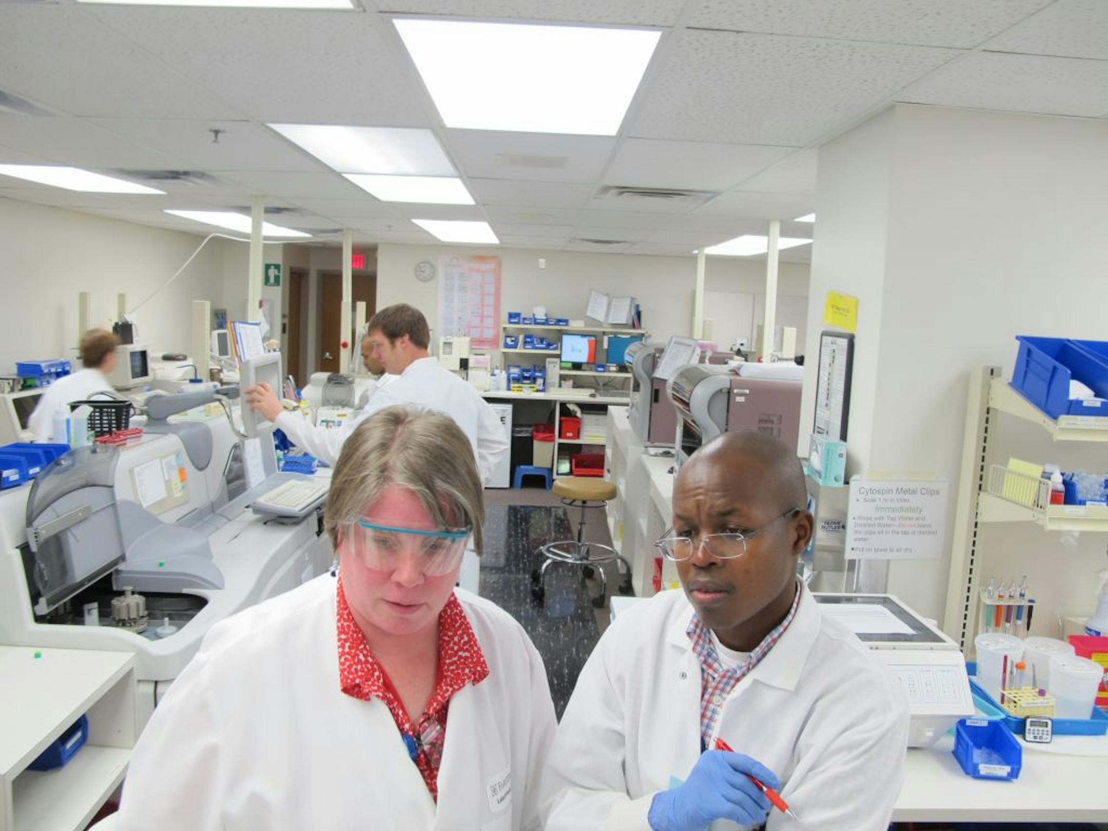 Elaine Kaney, left, and Jacob Okioma. John Dvorak in background