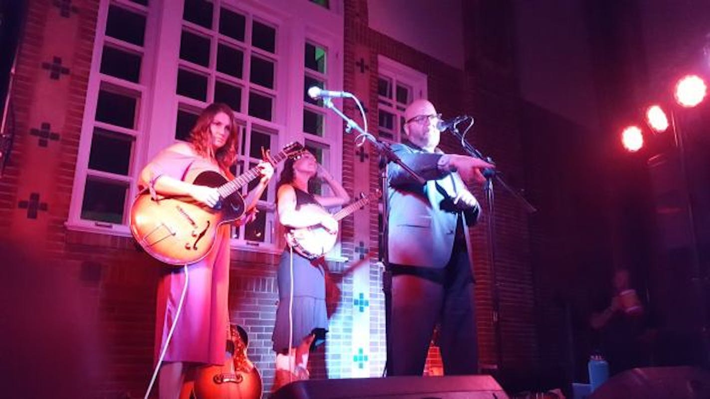 Mark Woodrich recently introduced Dusty Heart's Molly Dean and Barbara Jean at the Concert Club of Owatonna, aka Jefts Hall. / Photo by Keith Williams