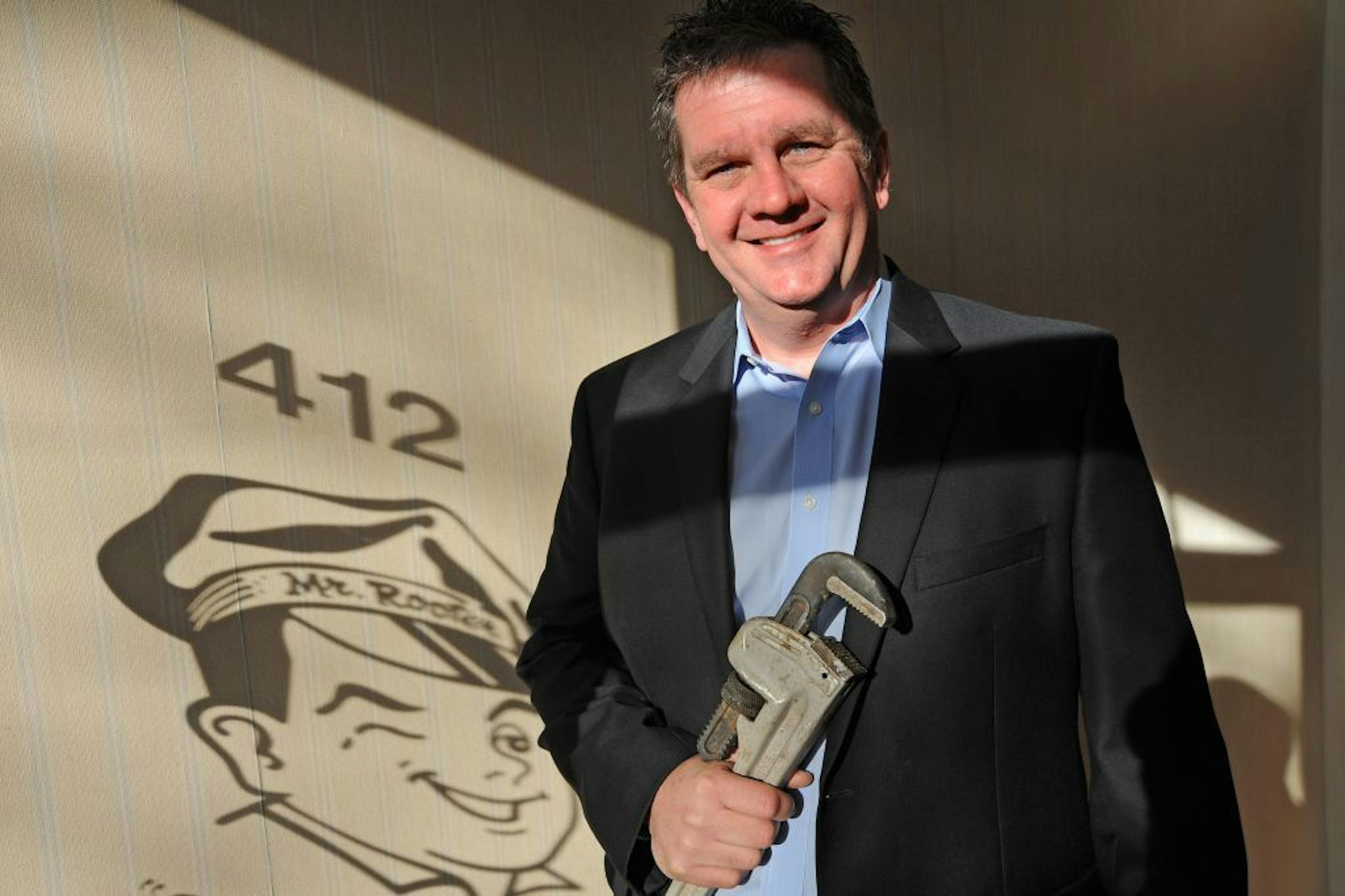 Mike Wickam, who paid his bills in college by working as a plumber, is returning to his roots after 20 years in marketing by taking over the Mr. Rooter Plumbing franchise in Minneapolis. Wickam, who had tired of corporate life and wanted his own business, believed the franchise was a good place to apply his turnaround skills. He's expanded service to commercial clients and is launching a nonprofit to offer free or low-cost plumbing services to low-income/elderly residents. Wickam posed for this