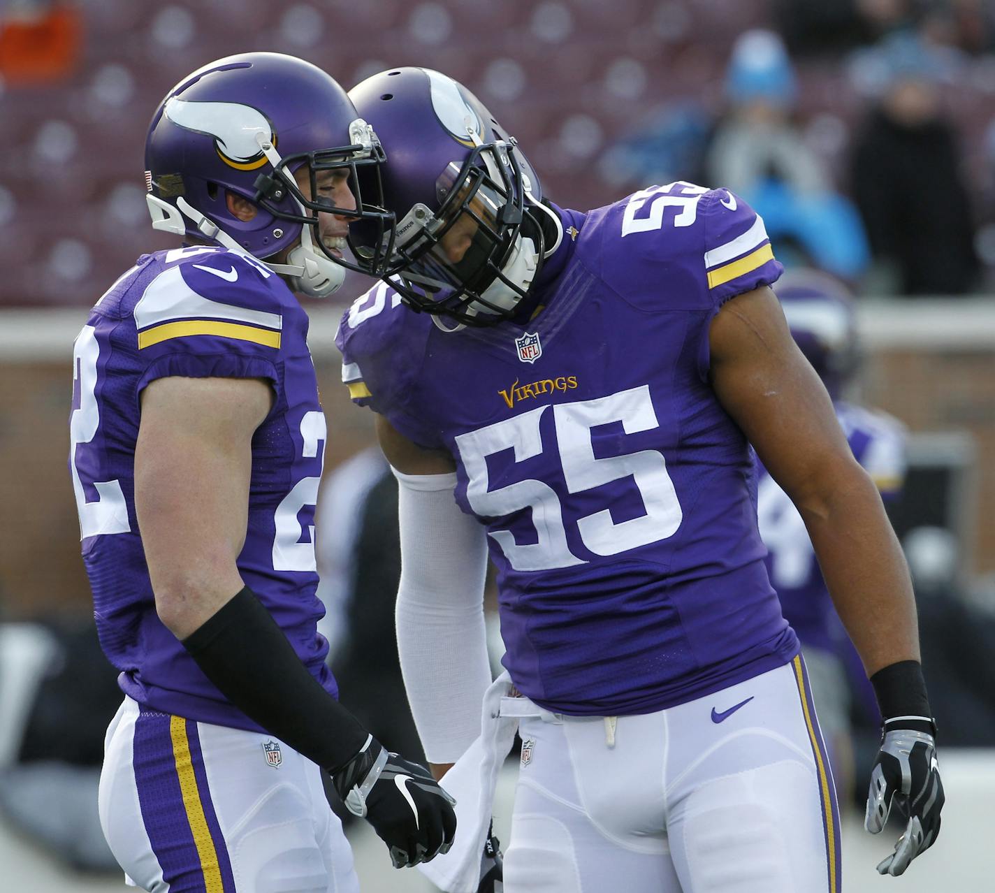 Minnesota Vikings outside linebacker Anthony Barr, right, talks with teammate Harrison Smith, left, before an NFL football game against the Carolina Panthers, Sunday, Nov. 30, 2014, in Minneapolis. (AP Photo/Ann Heisenfelt) ORG XMIT: MNCN1