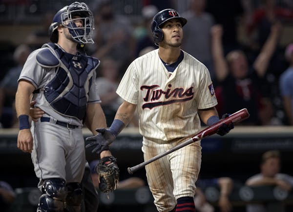 Eddie Rosario watched the ball after hitting a walk off 2-run home run in the tenth inning to win the game. Minnesota beat San Diego 3-1.