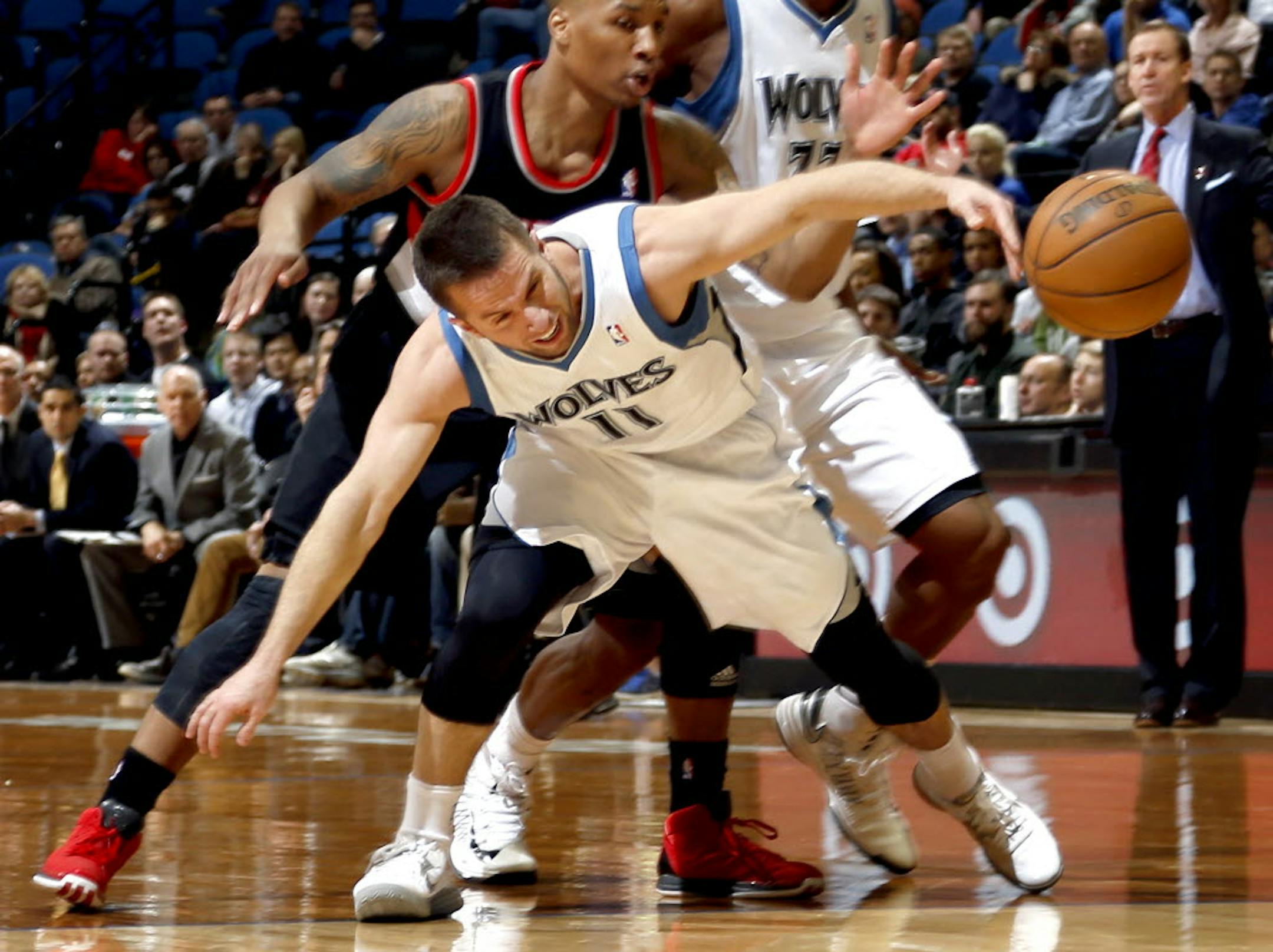 Minnesota's J.J. Barea (11) was fouled by Portland's Damian Lillard.
