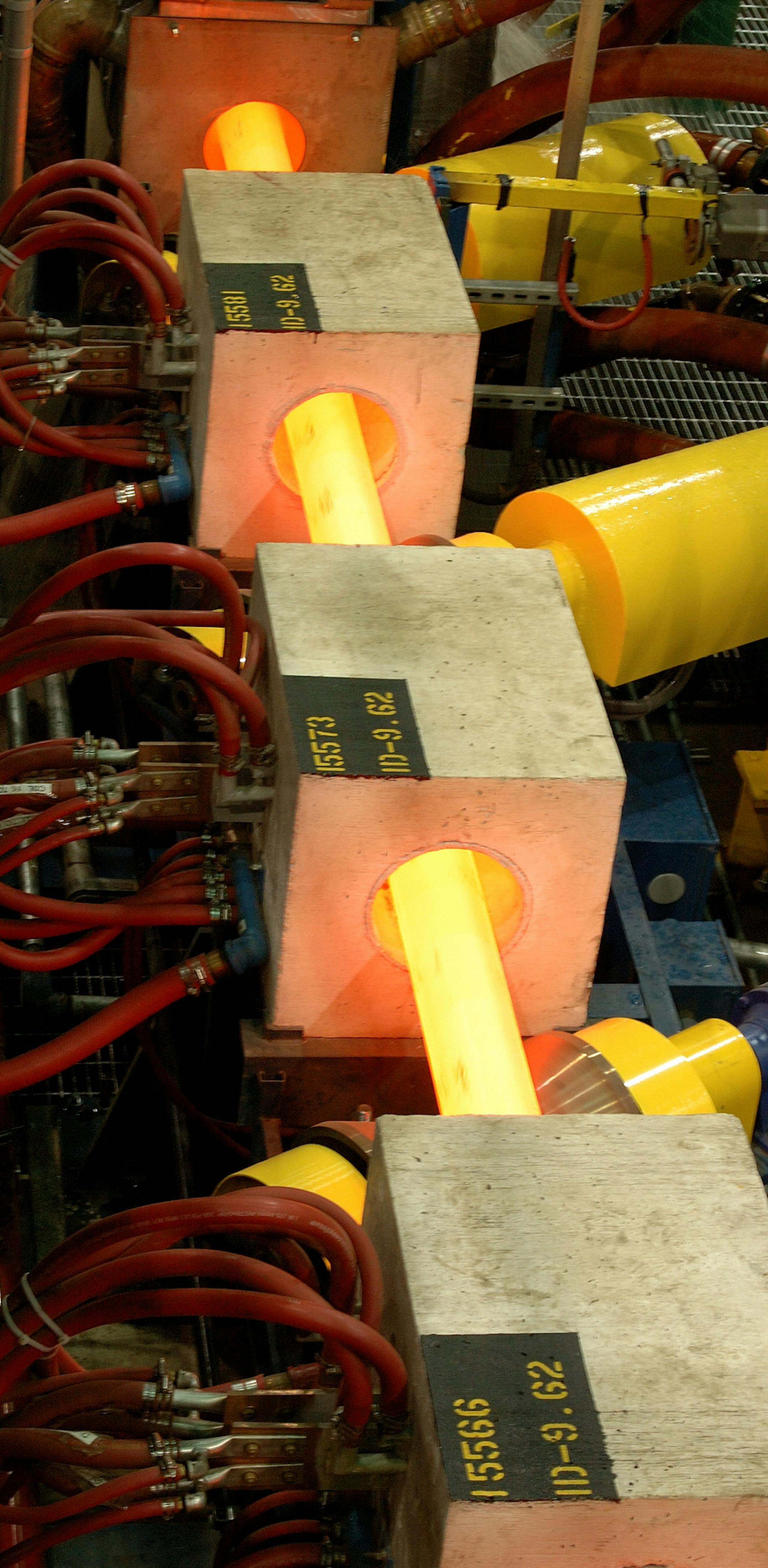 The United Steel Workers just sent me a drop box with photos of the steel pipes actually being made inside the factory. The red hot metal is being formed inside the device. " "Tubular Images - Texas Operations"
