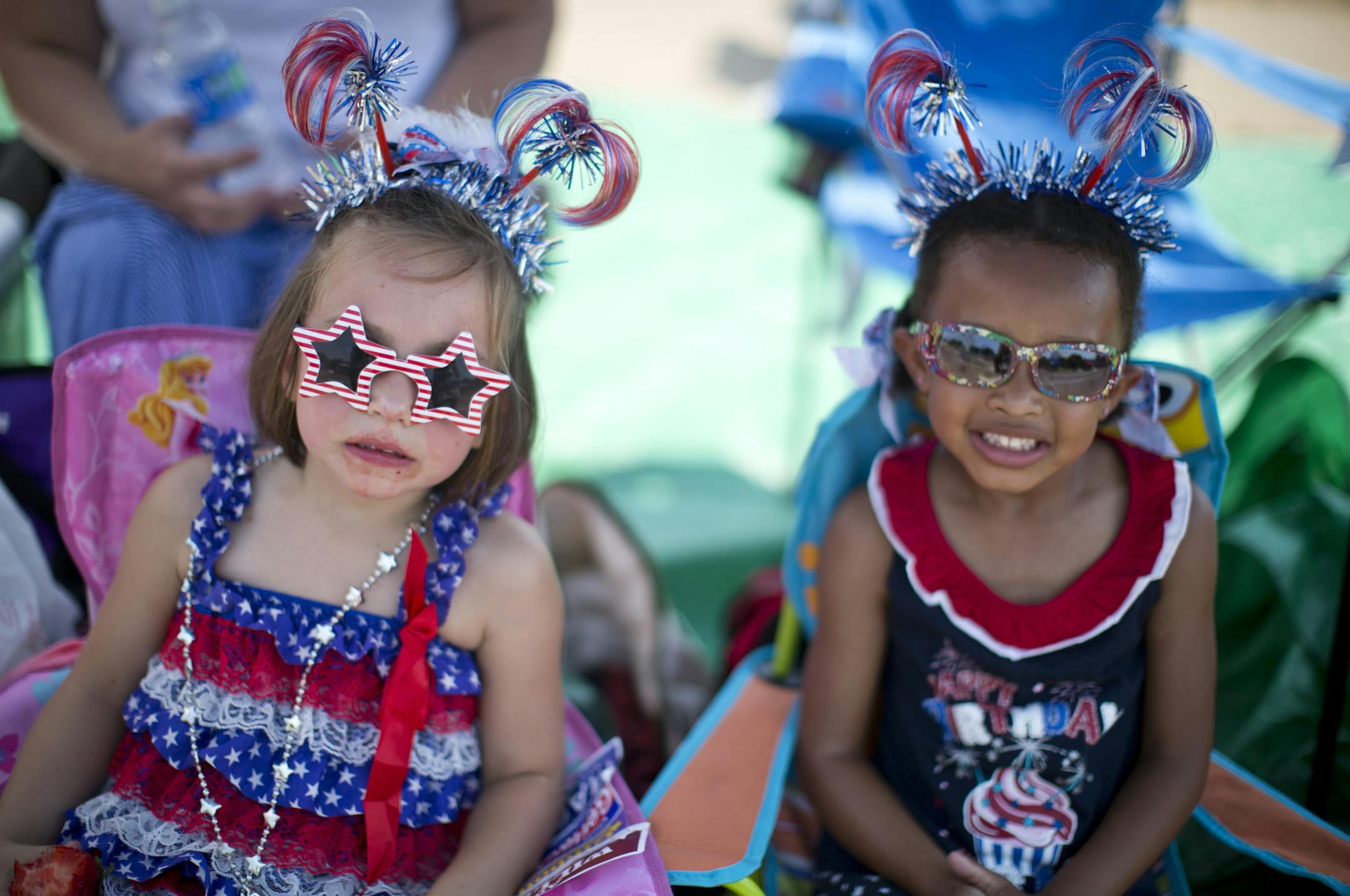 Olivia Owusu, 4, and Mia Noonan, 4, were dressed up in red white and blue during the Apple Valley Fourth of July Parade in Apple Valley, Minn. of July 4, 2012. ] (RENEE JONES SCHNEIDER &#x2022; reneejones@startribune.com) Olivia Owusu, Mia Noonan