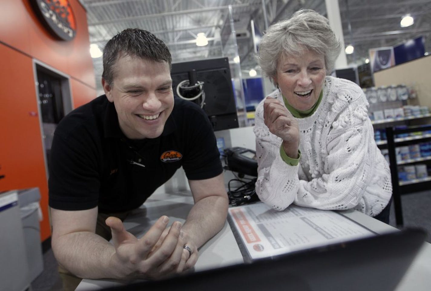 At the Best Buy store in Eden Prairie, Geek Squad agent Jay Resch helped Mary Knudten of Chanhassen with the laptop she bought.