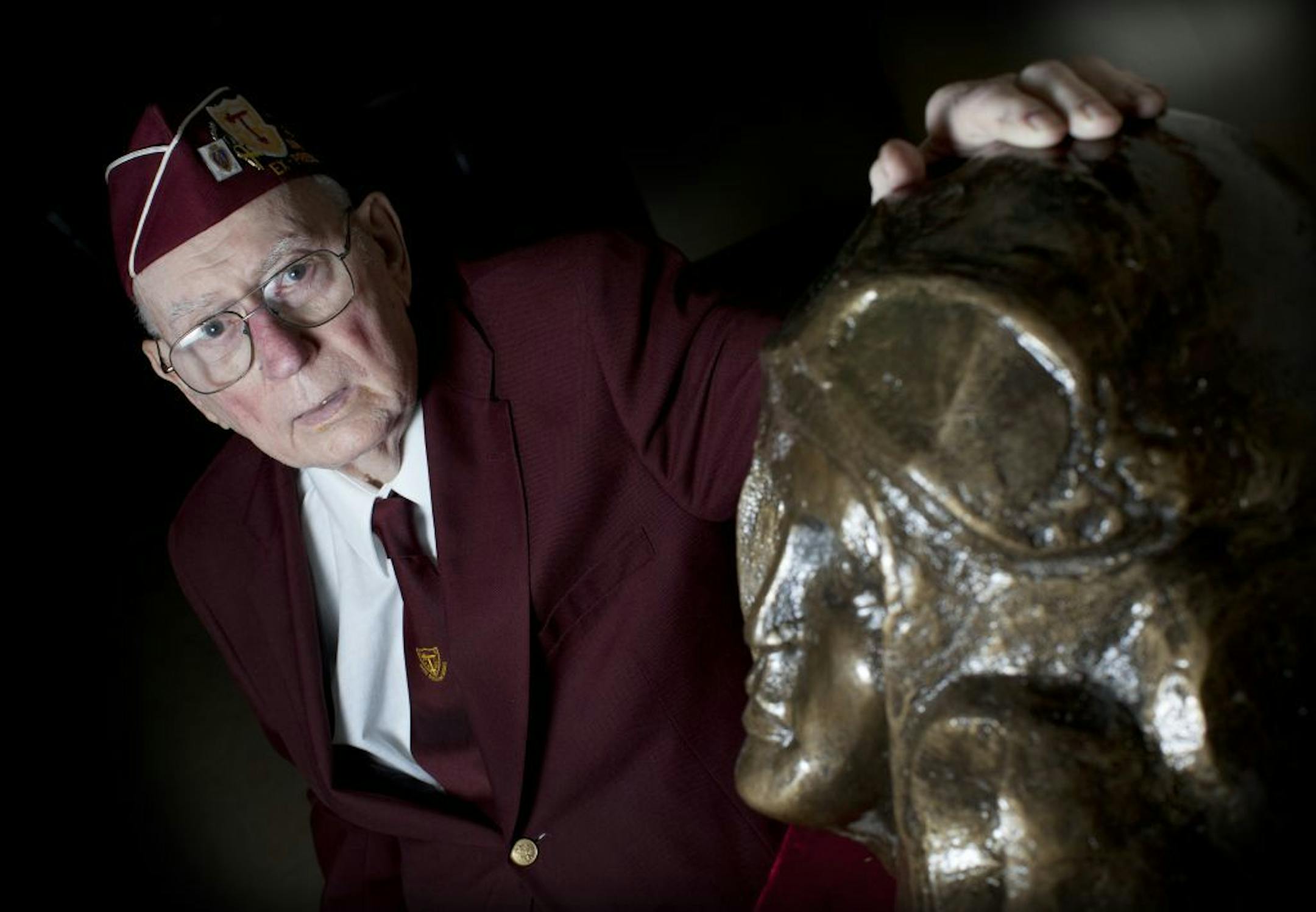 Walter Grotz, a WWII veteran and former POW, was gifted a 133 pound bronze bust of an American aviator that was made by an artist in Poland in appreciation for the Polish freedom that was secured as a result of WWII. It took Grotz years to get it delivered to his hometown Delano and is now on display at the American Legion there. He posed for a photograph on Monday, November 7, 2011 in Delano, Minn.