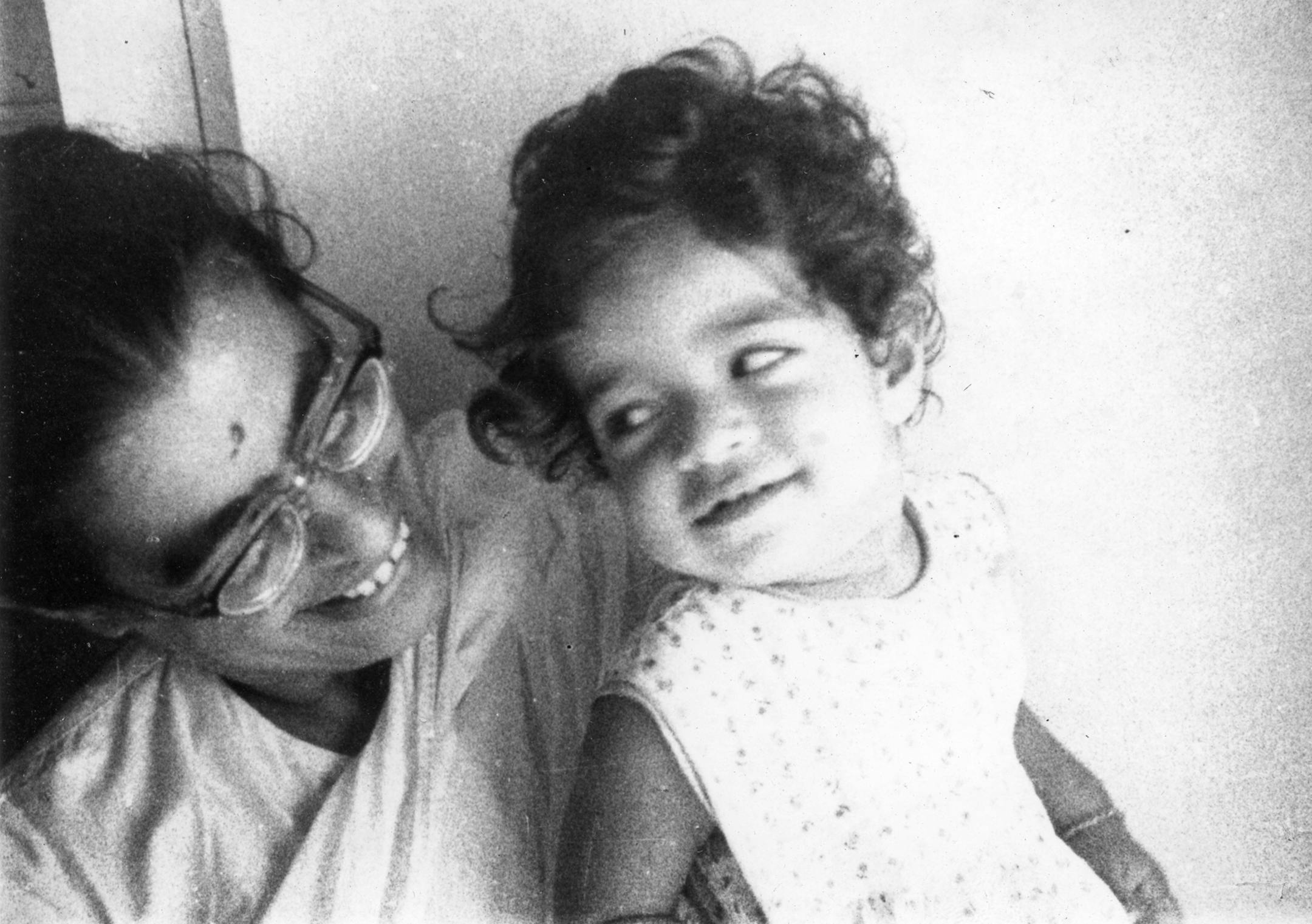 Gita Mazumdar, St. Paul: "Thatís my mum, her bindi smeared from kissing me multiple times. 55 years ago, she worked as a pediatrician, full time, practicing what she preached. She came home twice during her long work day to nurse me. Although she did her residency and post-graduate studies in the U.S. (in the 1950ís) she returned, with my father, to grow two children in India. It was a lovely venue for my childhood. Thank you dear Ma!" Mom was Mira Mazumdar.